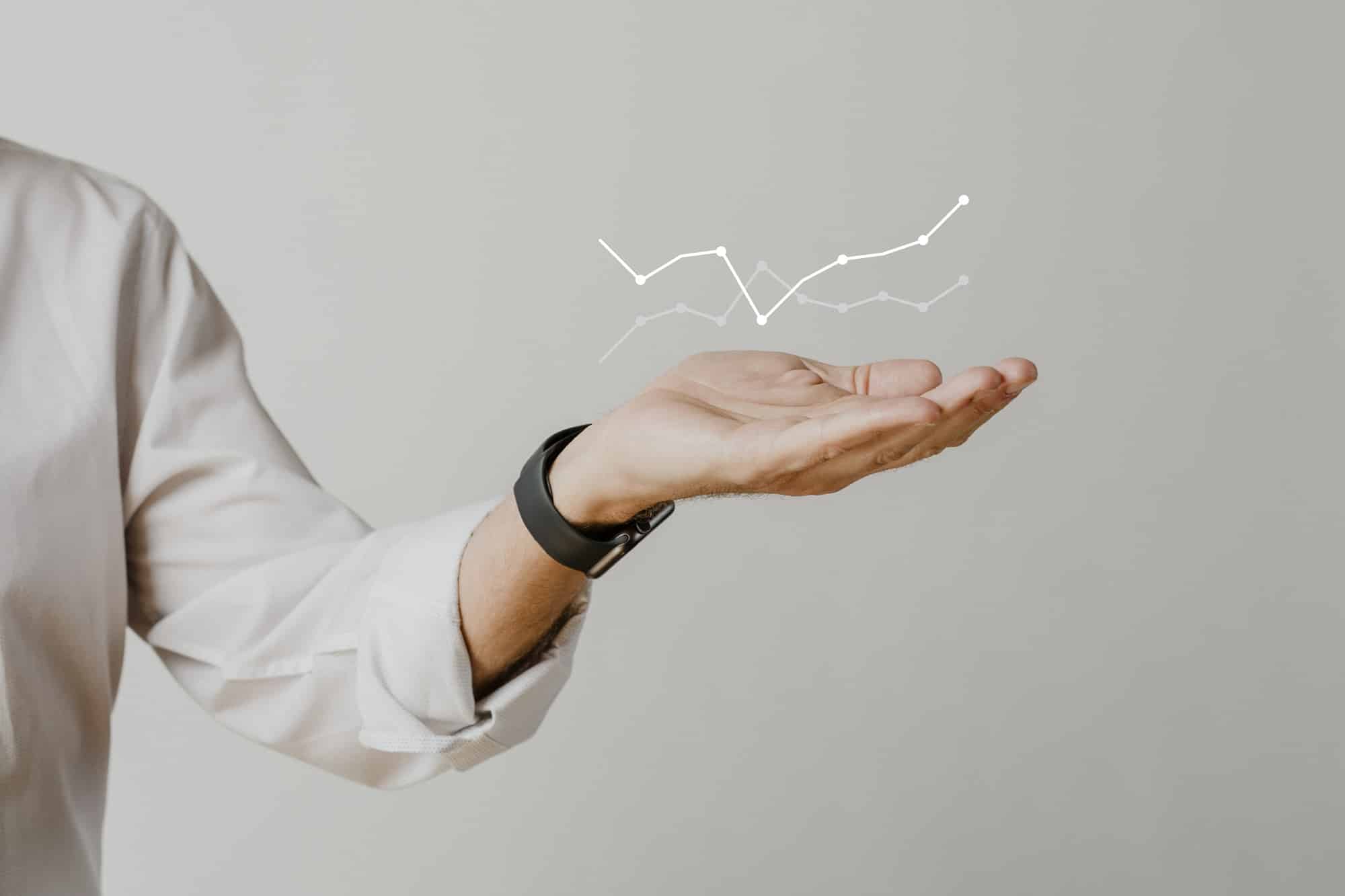 digital-graph-with-businessman-hand-overlay